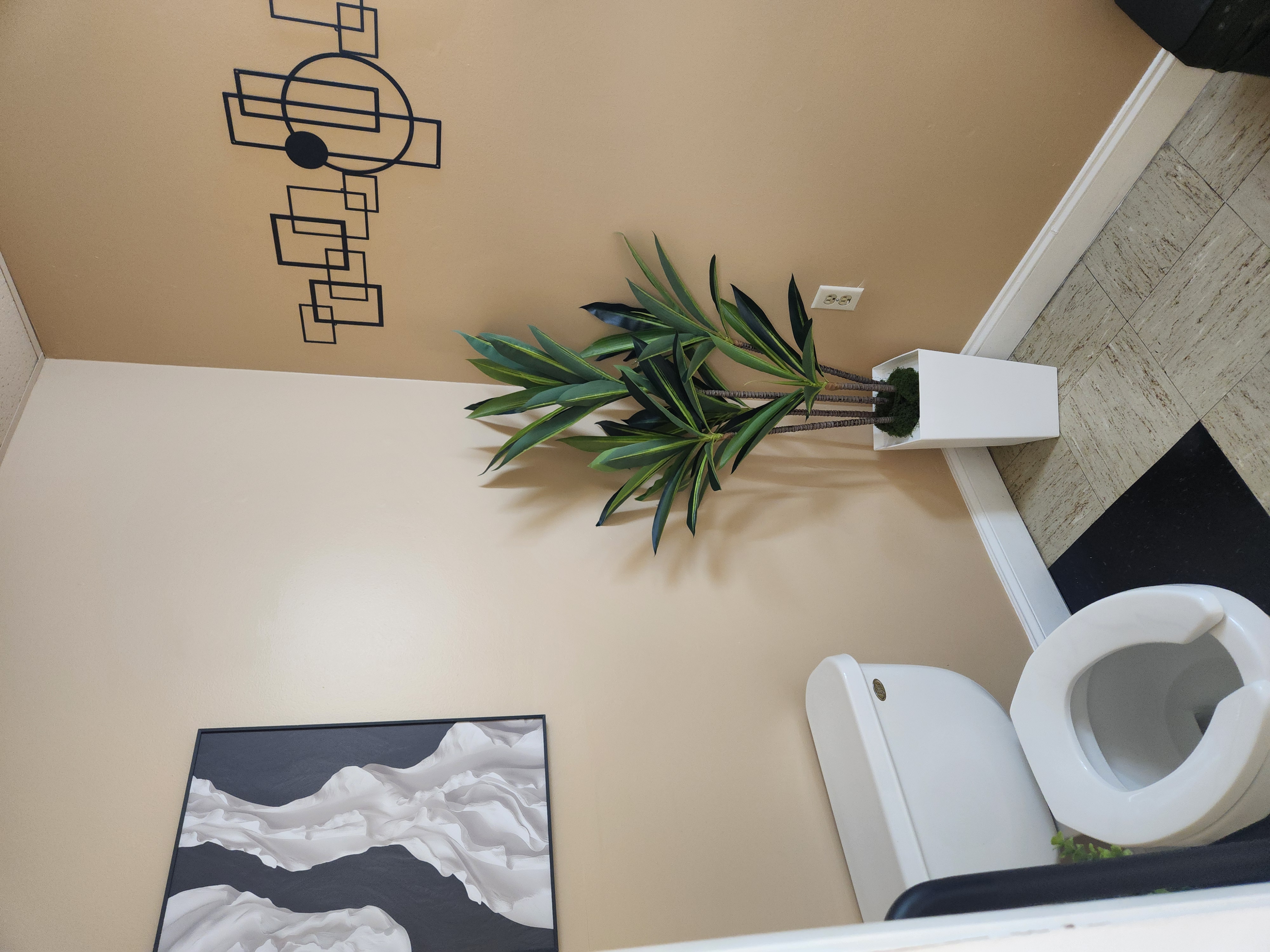 Suite with natural light and cabinetry at Amin 1 Salon Suites