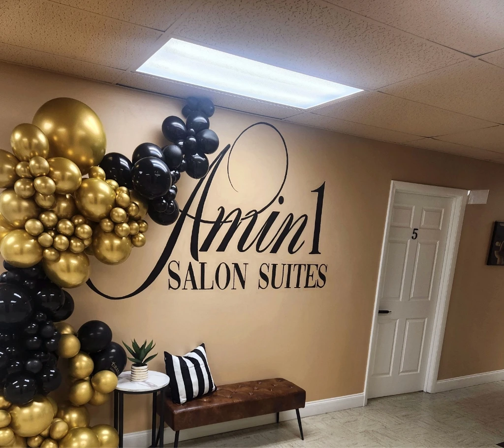 Amin 1 Salon Suites main entrance wall logo and grand reception area